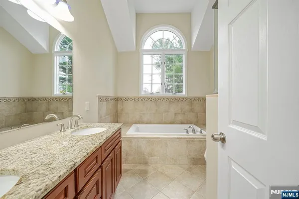 a bath tub sitting next to a window