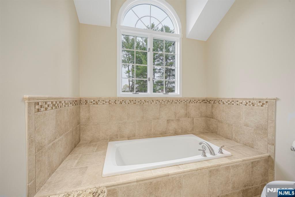 67 Davenport Road Montville, NJ 07045 - Photo 18 of 32 a bath tub sitting next to a window