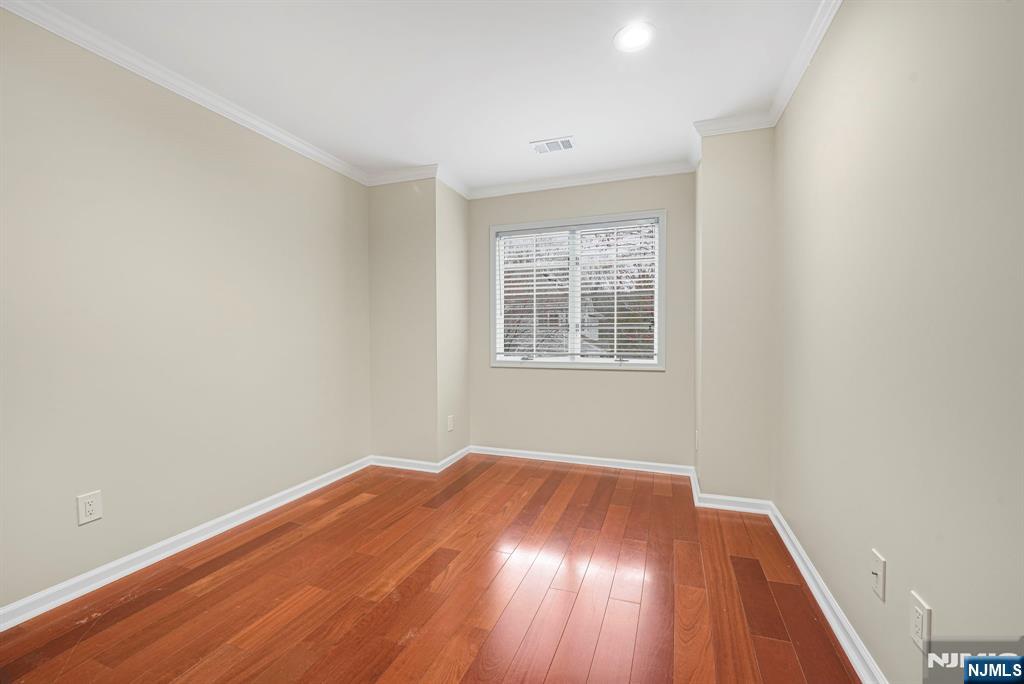 67 Davenport Road Montville, NJ 07045 - Photo 20 of 32 an empty room with wooden floor and windows