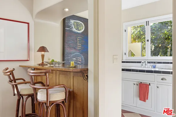 a view of a kitchen that has a sink and a window