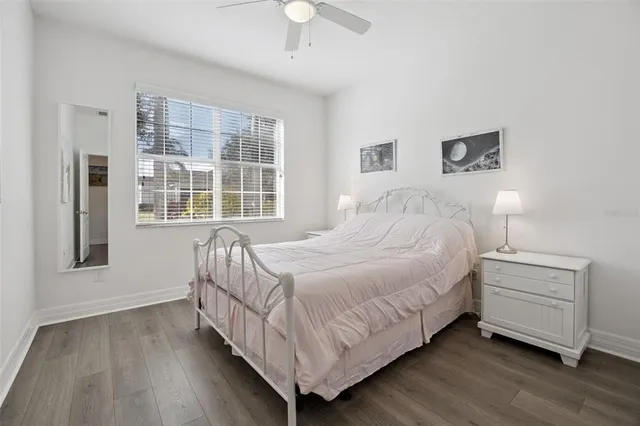 a bed room with a bed and a window