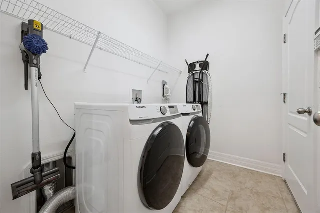 a utility room with dryer and washer