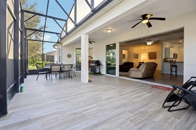a view of a livingroom with furniture and a gym equipment