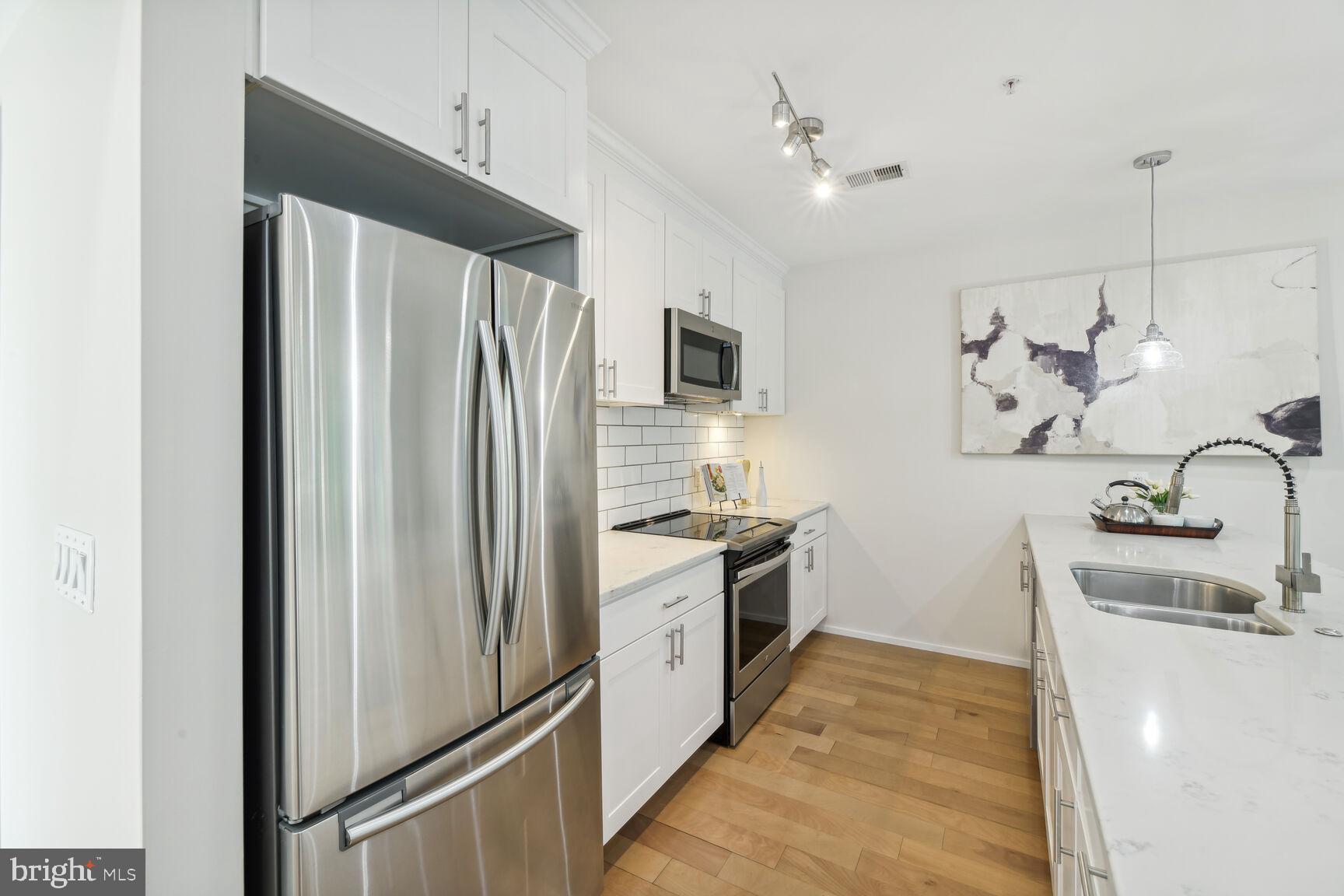 129 Varnum Street Northwest, Unit 1 Washington, DC 20011 - Photo 8 of 22 Kitchen layout is perfect for prepping .