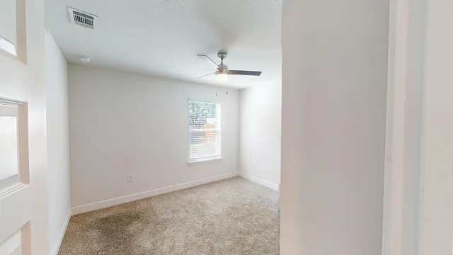 an empty room with windows