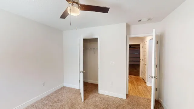 a view of an empty room with a window