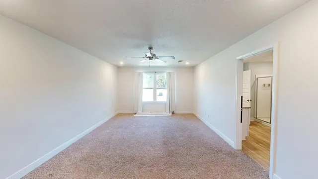 a bathroom with a shower and toilet