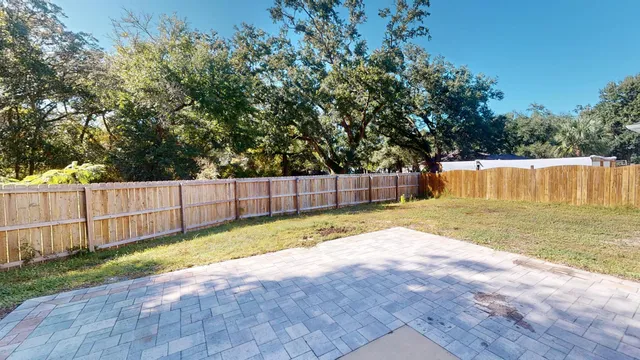 a view of backyard with tree