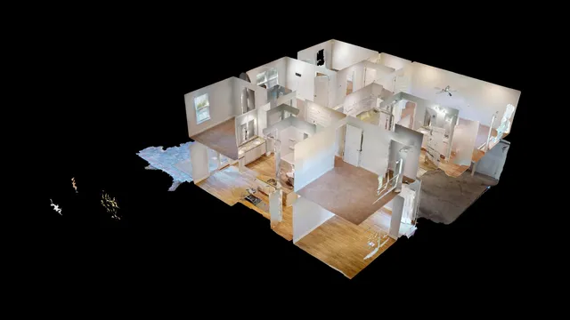 a white bed sitting in a bedroom next to a lamp