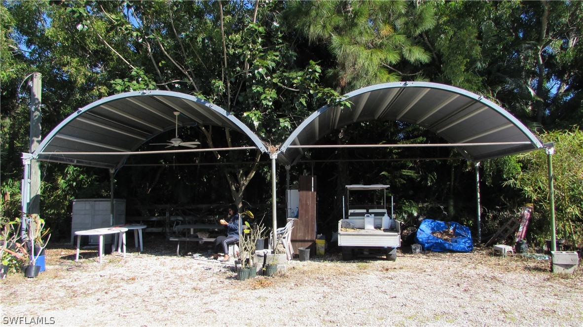 8390 Stringfellow Road St. James City, FL 33956 - Photo 2 of 35 a view of outdoor space deck and entertaining space