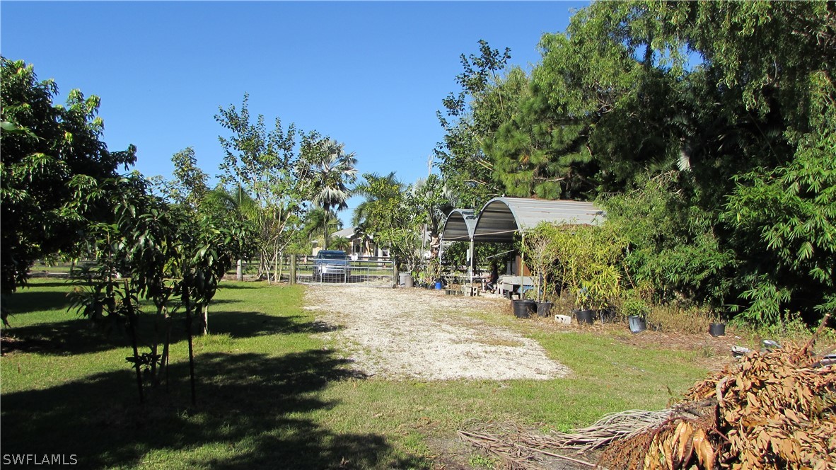 8390 Stringfellow Road St. James City, FL 33956 - Photo 30 of 35 a view of a park with trees and grass