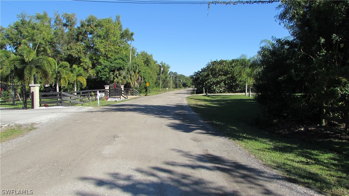 8390 Stringfellow Road St. James City, FL 33956 - Photo 32 of 35 a view of a street with a yard