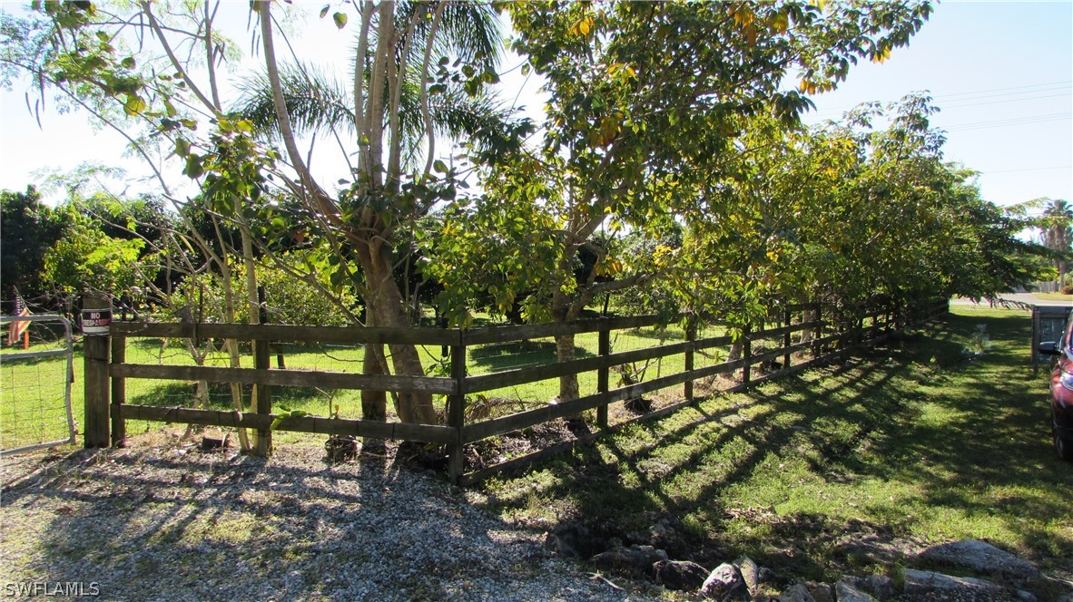 8390 Stringfellow Road St. James City, FL 33956 - Photo 34 of 35 a view of a yard with large trees