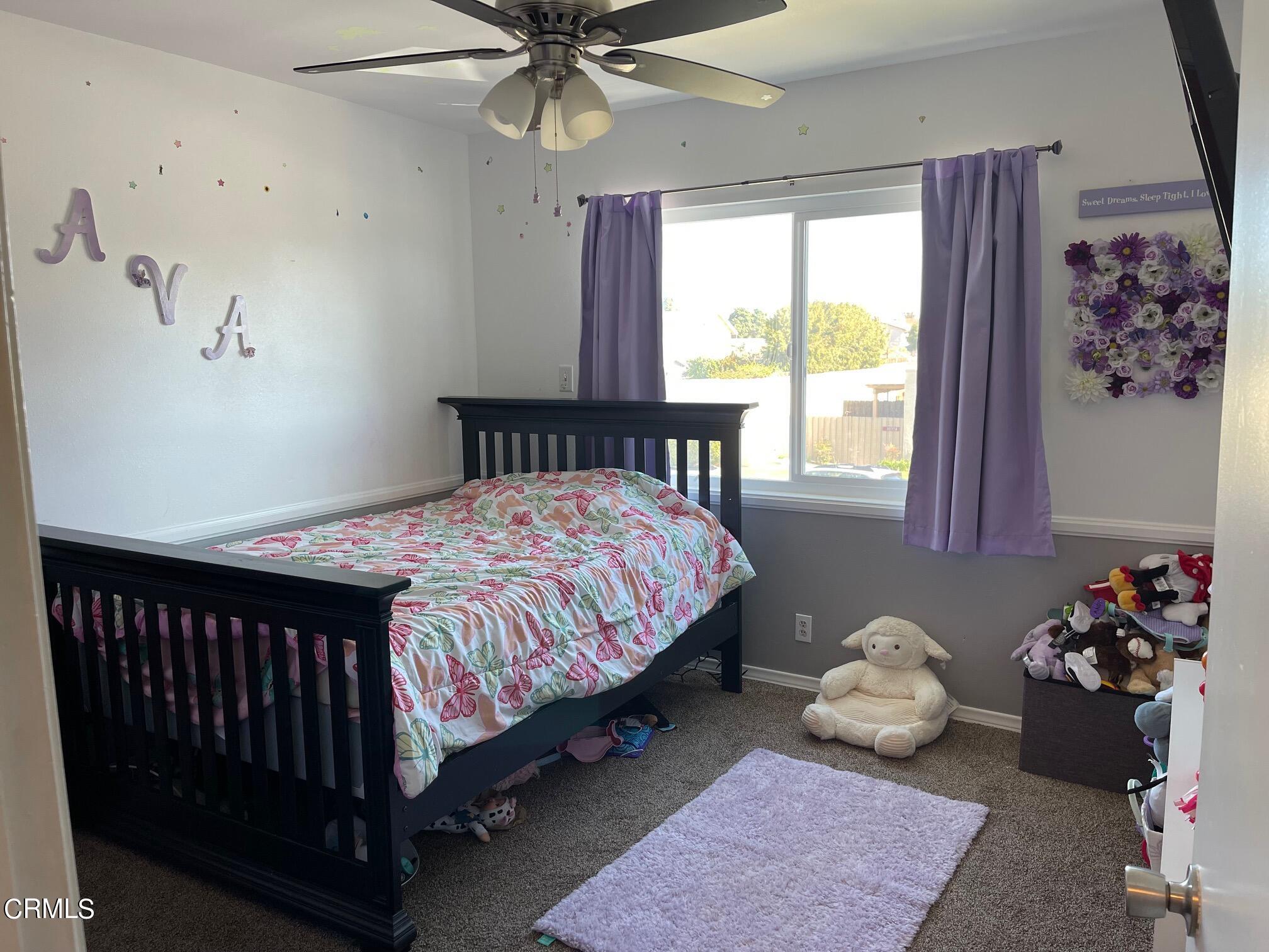 1831 Jetty Street Oxnard, CA 93035 - Photo 14 of 20 a bedroom with a bed and a window