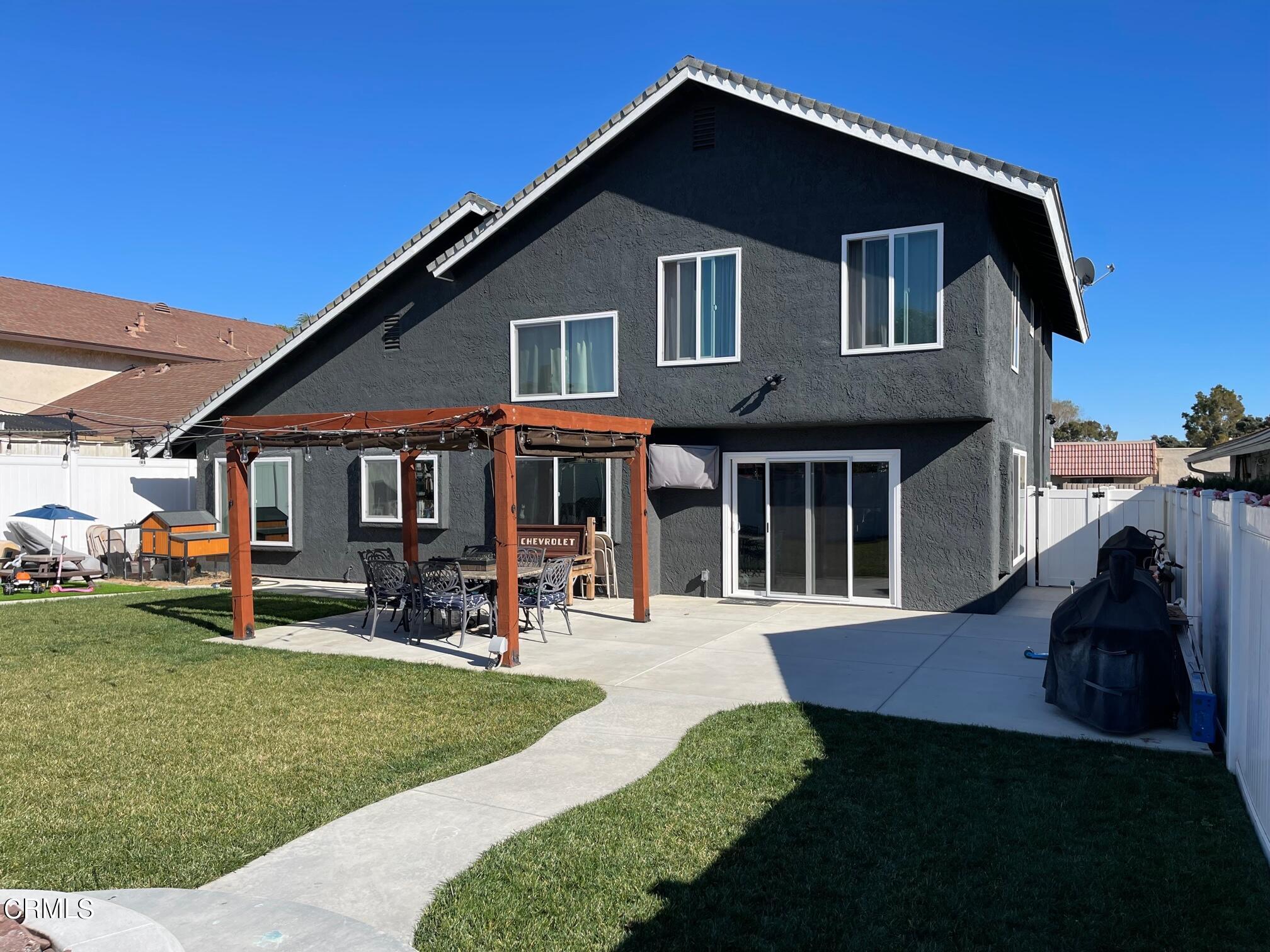 1831 Jetty Street Oxnard, CA 93035 - Photo 17 of 20 a front view of a house with garden and porch