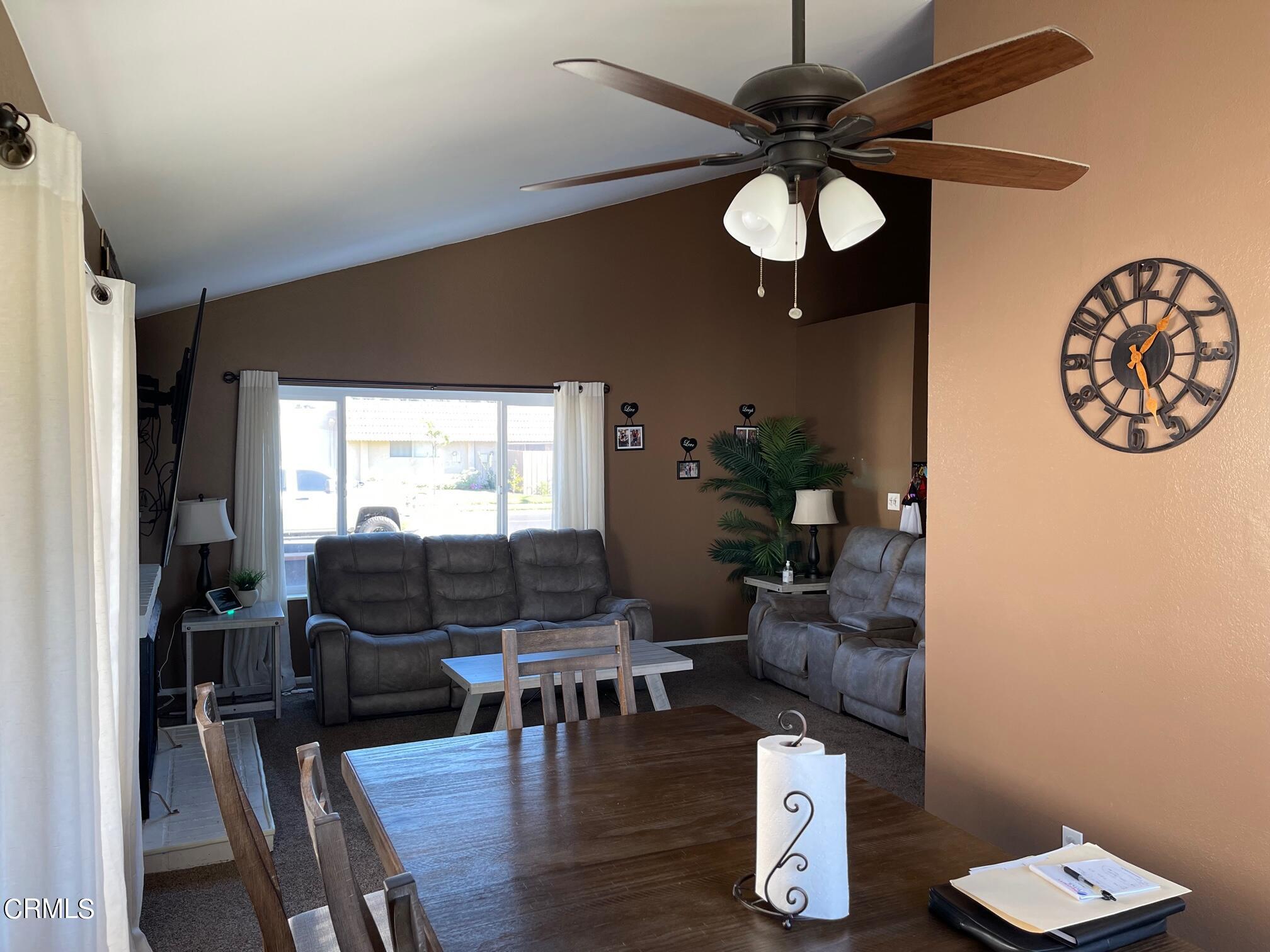 1831 Jetty Street Oxnard, CA 93035 - Photo 2 of 20 a living room with furniture a window and a chandelier
