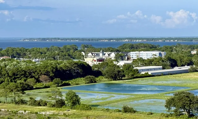 a view of a lake with a yard