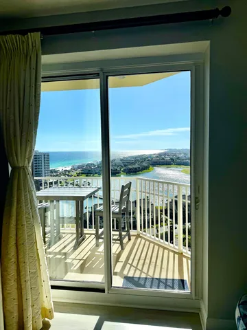 a view of a balcony with wooden floor