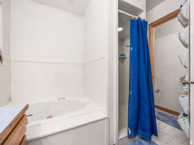 598 West 1600th Street North Mapleton, UT 84664 - Photo 13 of 34 Bathroom with a stall shower, a garden tub, and vanity