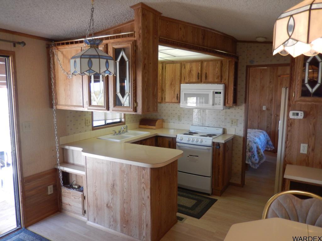 68202 Simcox Road Salome, AZ 85348 - Photo 4 of 7 a kitchen with a stove and a sink