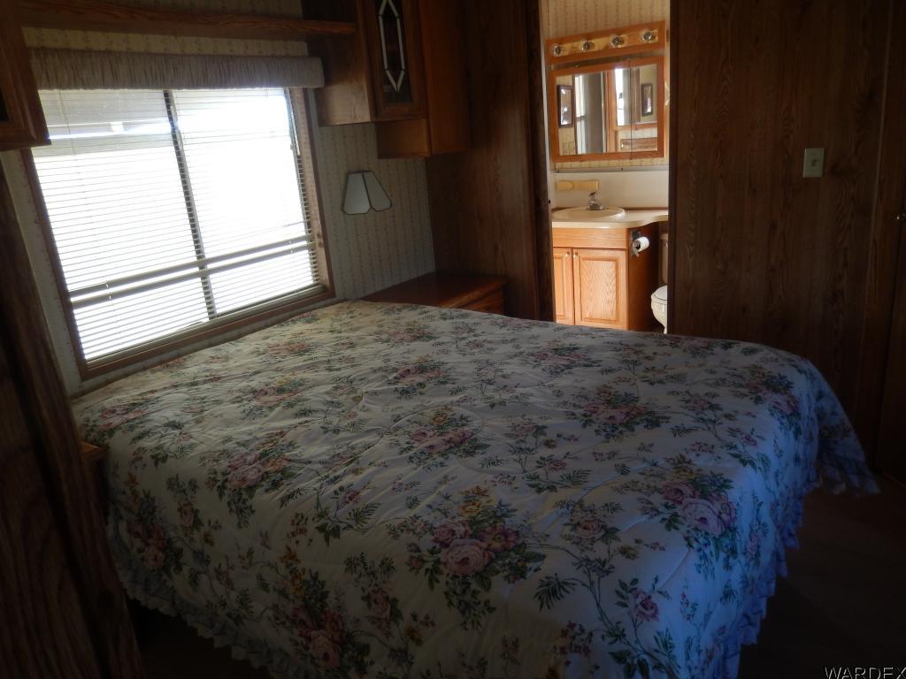 68202 Simcox Road Salome, AZ 85348 - Photo 5 of 7 a bedroom with a bed and a window