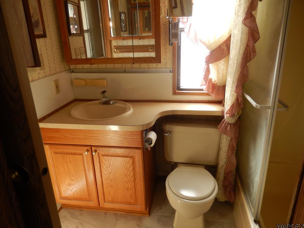 68202 Simcox Road Salome, AZ 85348 - Photo 7 of 7 a bathroom with a sink and a toilet
