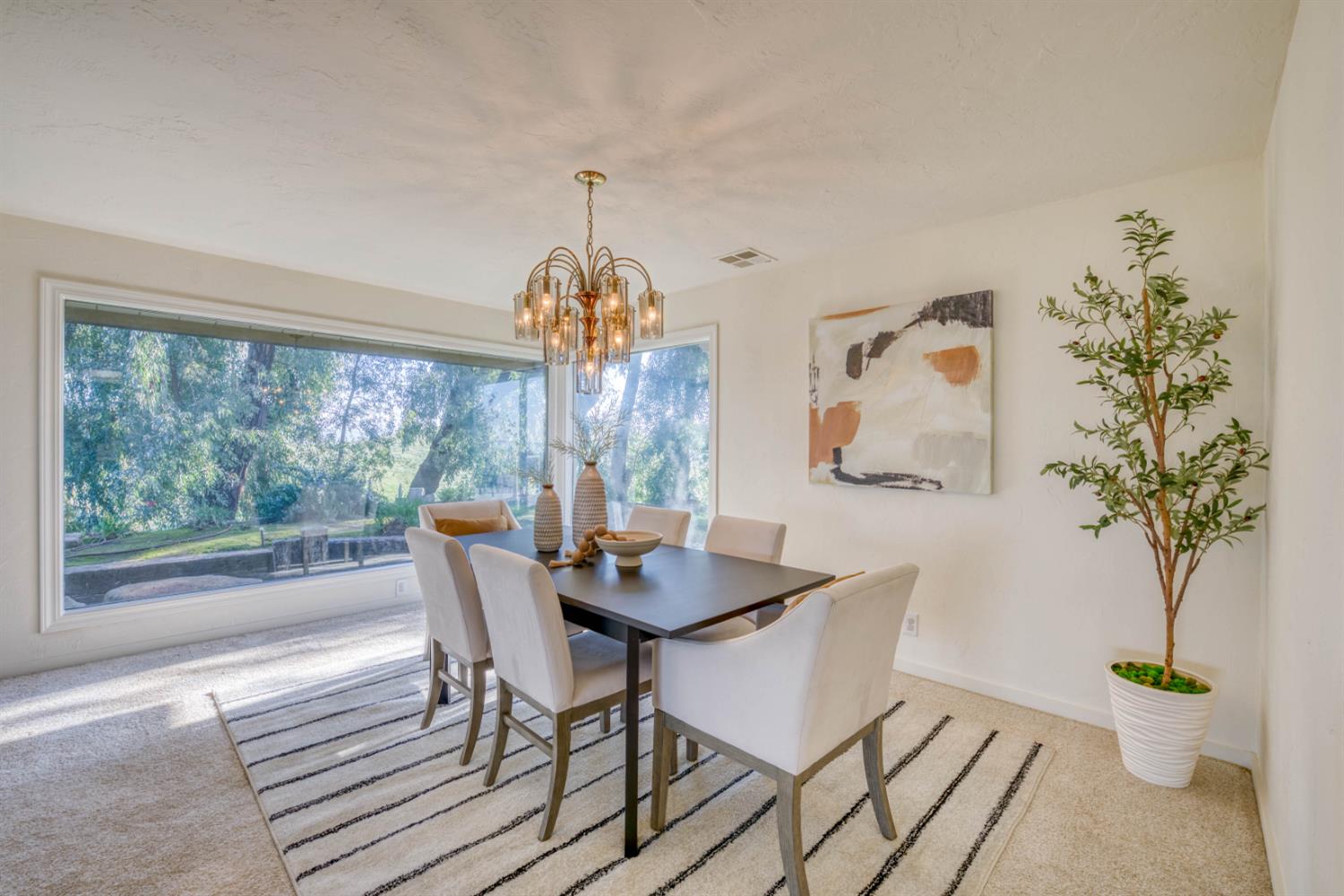 4578 Millerton Road Friant, CA 93626 - Photo 25 of 97 a dining room with furniture chandelier and wooden floor