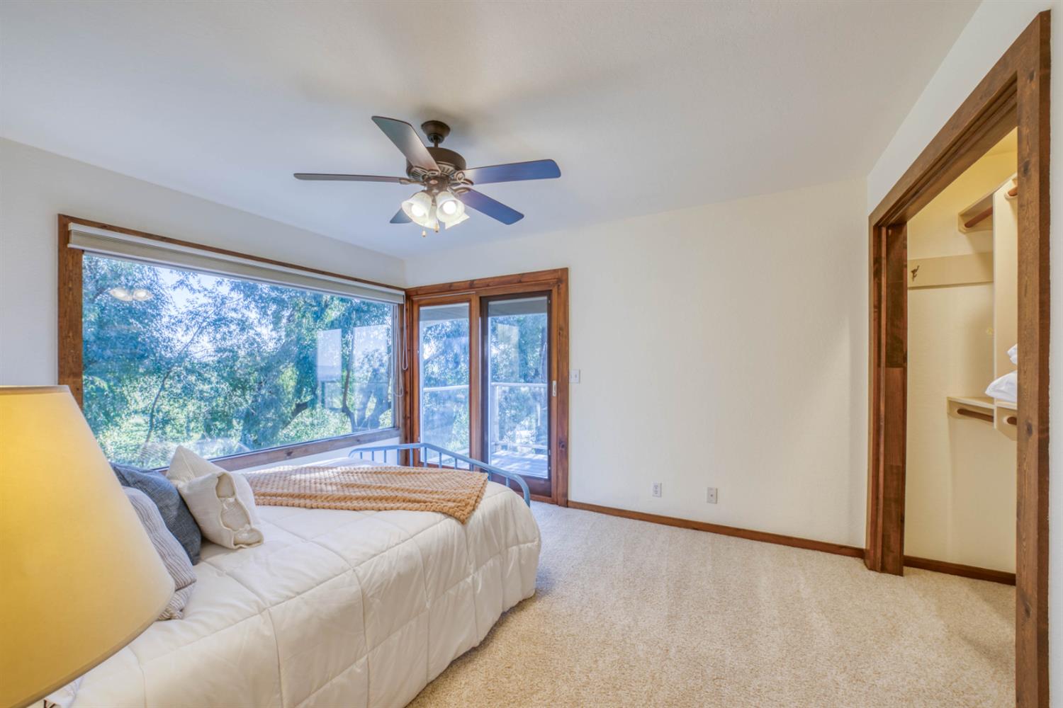 4578 Millerton Road Friant, CA 93626 - Photo 38 of 97 a bedroom with a large bed and a large window