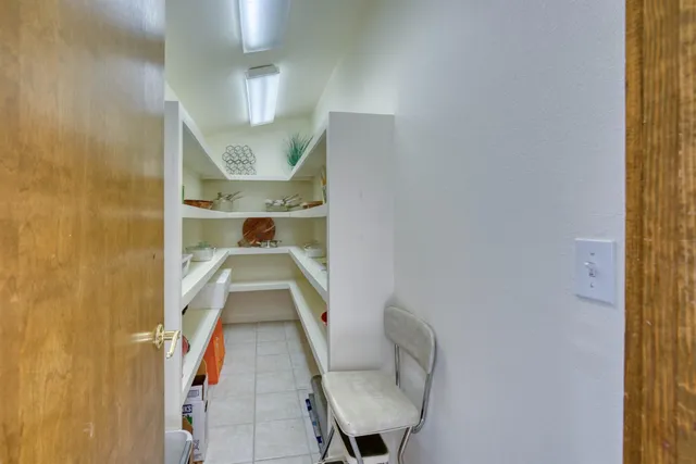 a swimming pool is sitting in front of a house