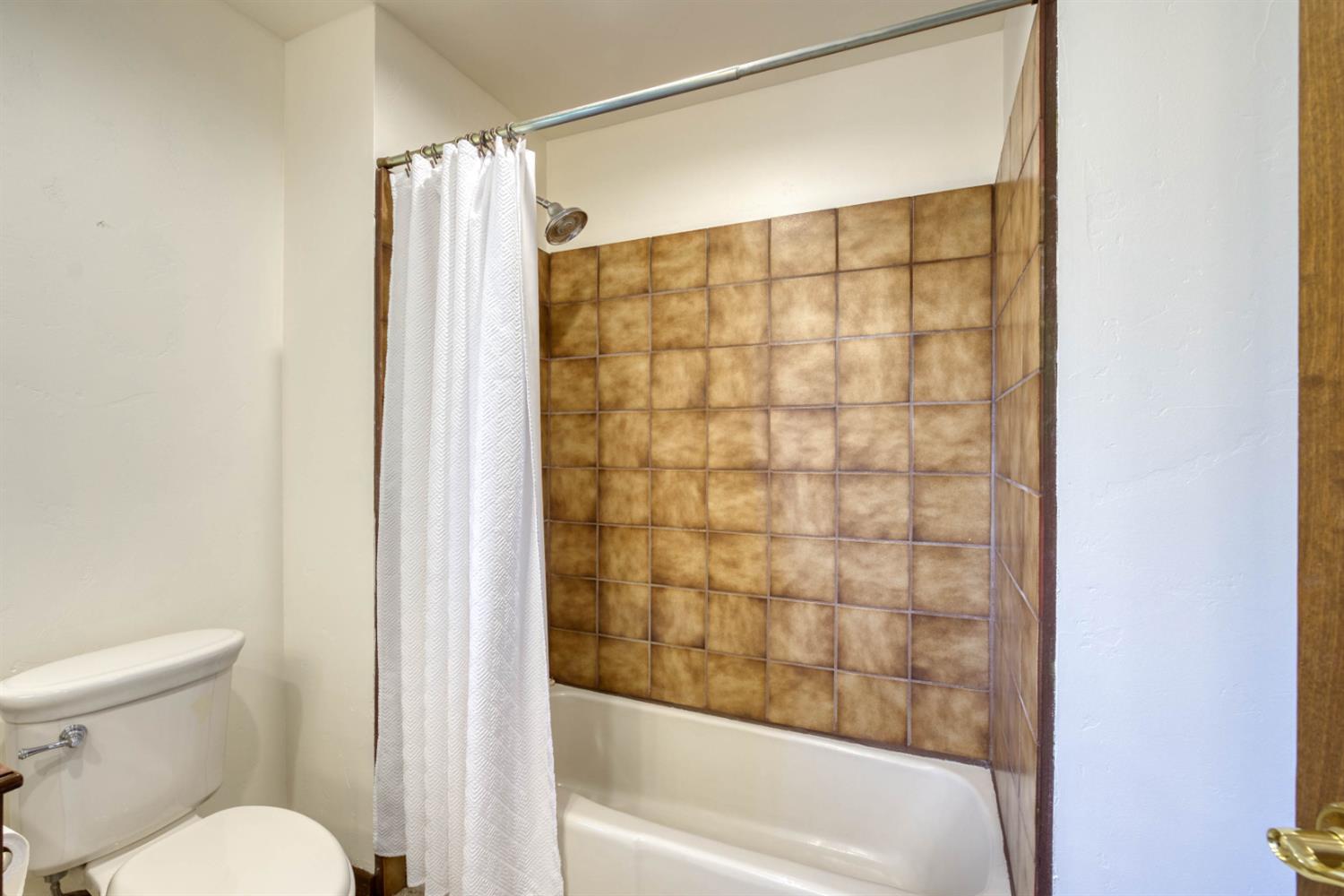 4578 Millerton Road Friant, CA 93626 - Photo 49 of 97 a bathroom with a shower and a toilet