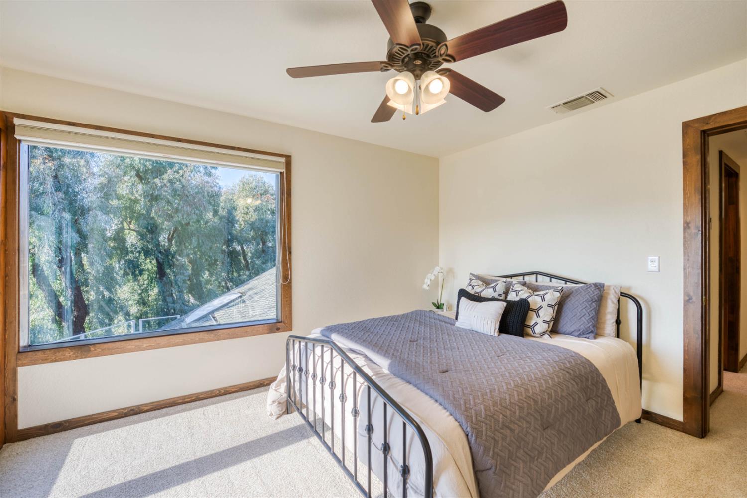 4578 Millerton Road Friant, CA 93626 - Photo 51 of 97 a bedroom with a large bed and a large window