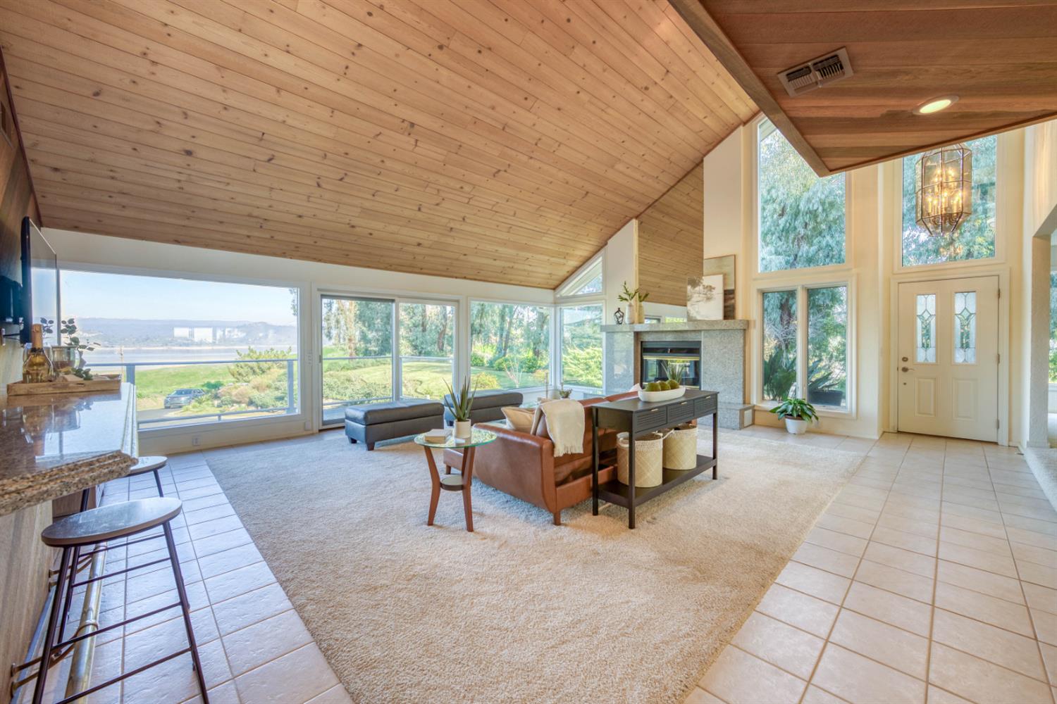 4578 Millerton Road Friant, CA 93626 - Photo 68 of 97 a living room with furniture and large windows