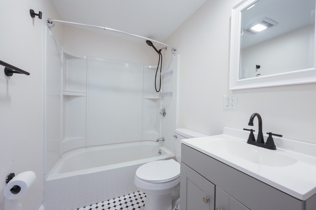 25 Bailey Road Townsend, MA 01474 - Photo 19 of 29 a bathroom with a sink a toilet and shower