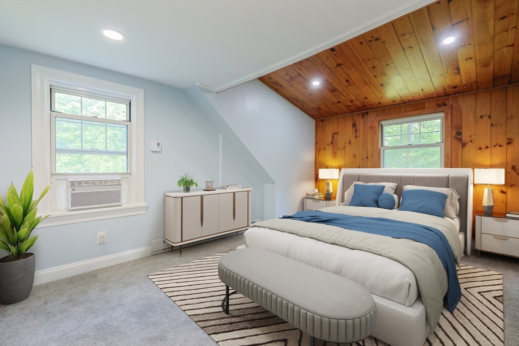 25 Bailey Road Townsend, MA 01474 - Photo 20 of 29 a spacious bedroom with a large bed and windows
