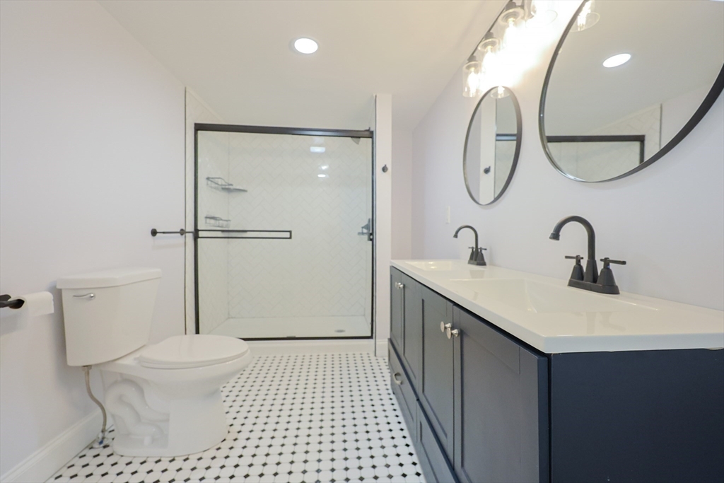 25 Bailey Road Townsend, MA 01474 - Photo 24 of 29 a bathroom with a sink a toilet and a mirror