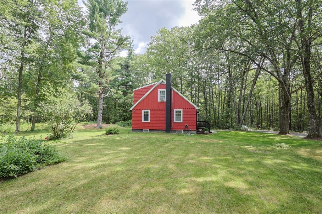 25 Bailey Road Townsend, MA 01474 - Photo 27 of 29 a house is sitting in middle of the forest