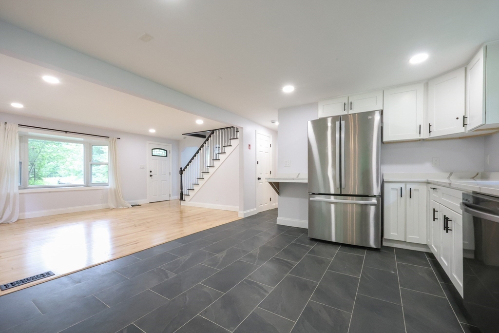 25 Bailey Road Townsend, MA 01474 - Photo 7 of 29 a kitchen with a refrigerator a sink and a stove