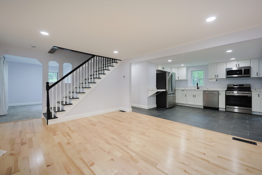 25 Bailey Road Townsend, MA 01474 - Photo 10 of 29 a view of a kitchen with a sink and a stove top oven