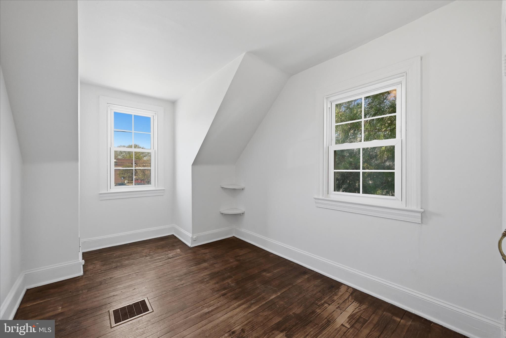 510 North Pleasant Valley Road Winchester, VA 22601 - Photo 34 of 63 an empty room with wooden floor and windows