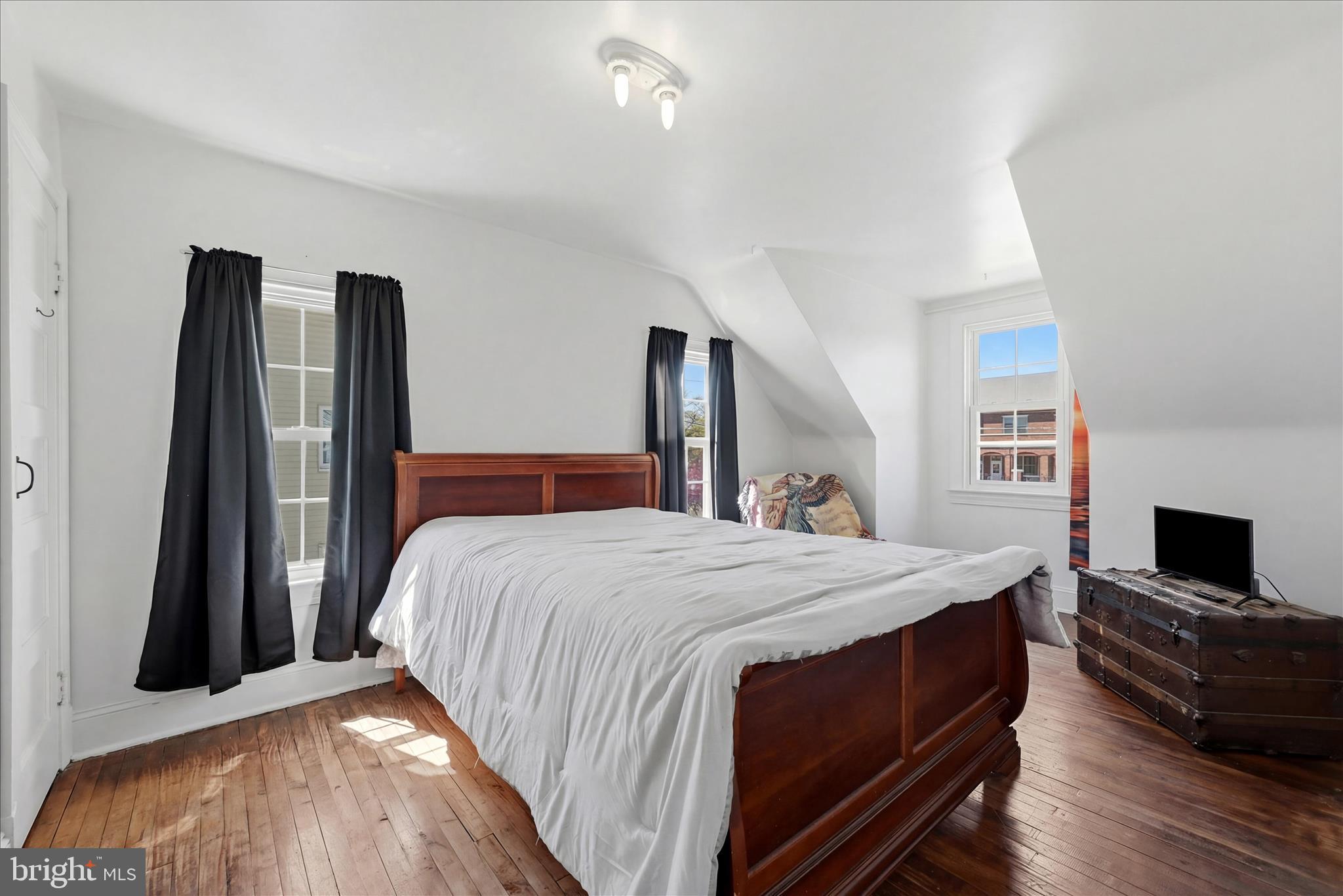 510 North Pleasant Valley Road Winchester, VA 22601 - Photo 37 of 63 a spacious bedroom with a bed and a flat screen tv