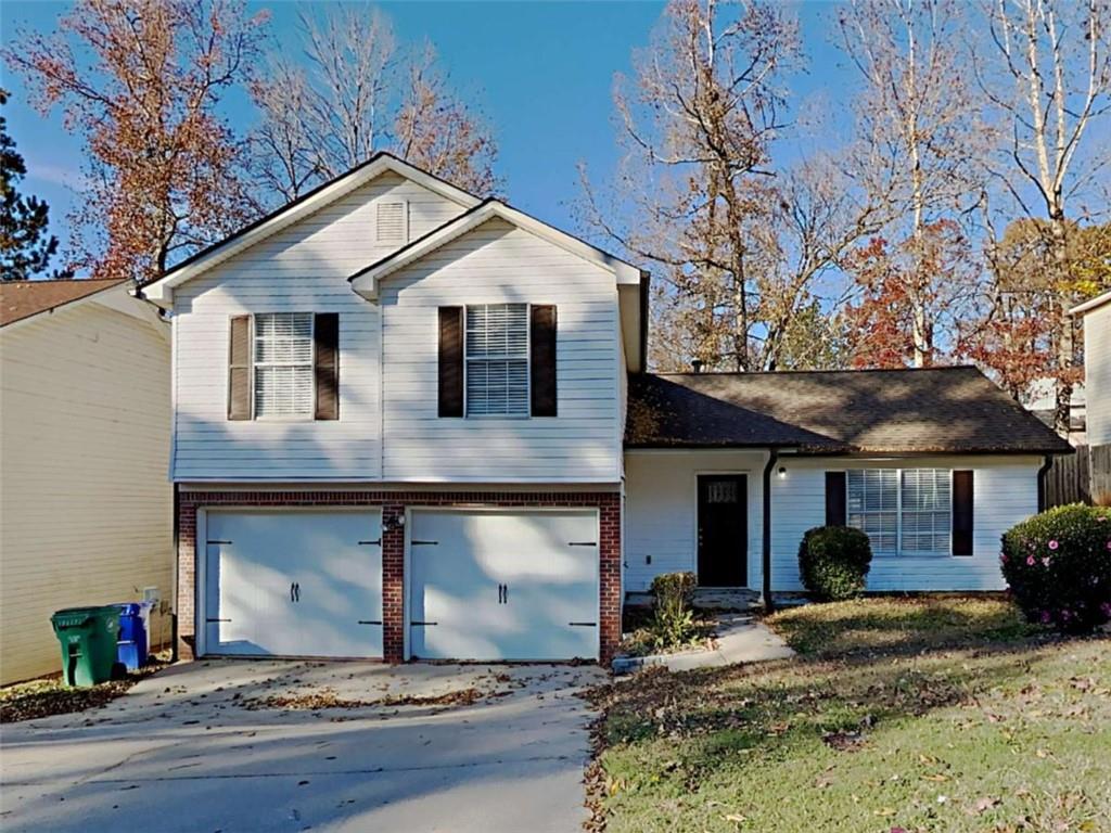 4856 Haymarket Trail Decatur, GA 30035 - Photo 1 of 1 a front view of a house with a yard