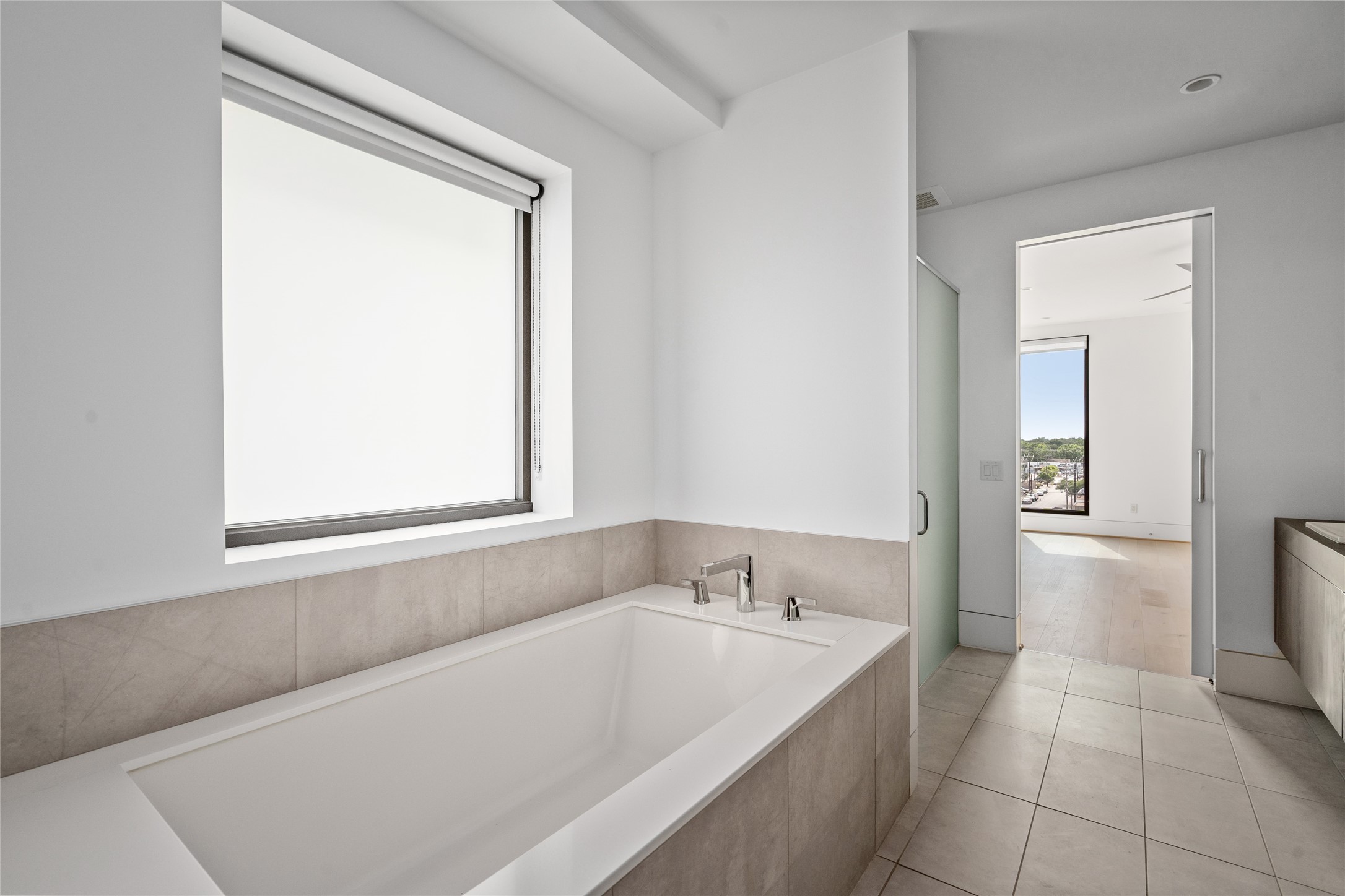 2406 Tangley Street, Unit 200 Houston, TX 77005 - Photo 14 of 20 a bathroom with a bathtub and a sink