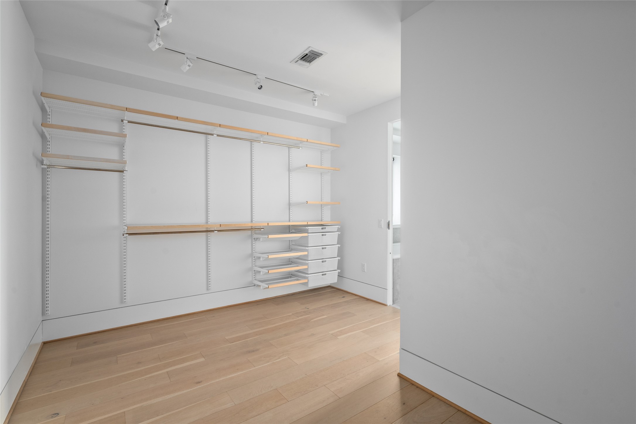2406 Tangley Street, Unit 200 Houston, TX 77005 - Photo 15 of 20 a view of walk in closet with empty racks