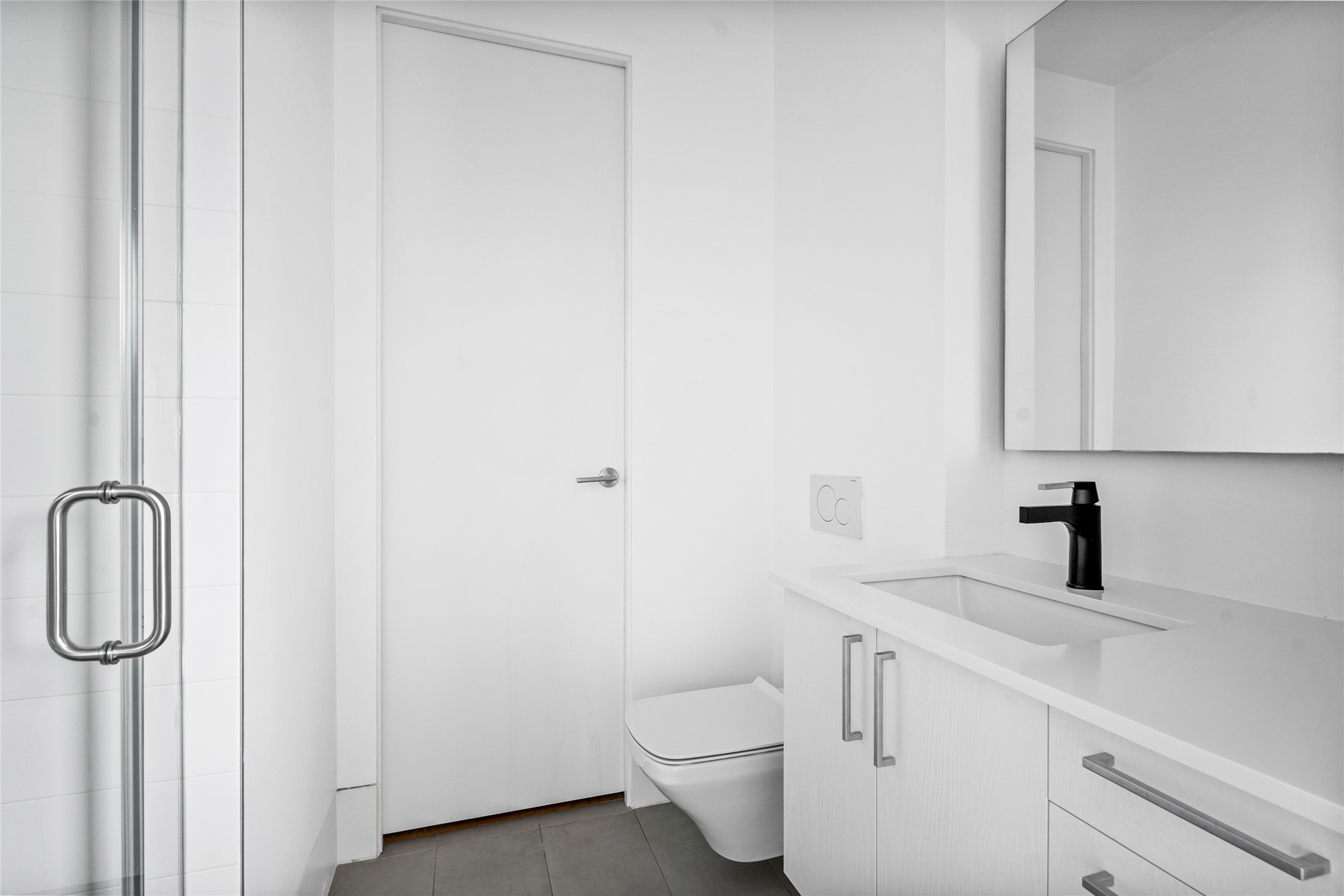 2406 Tangley Street, Unit 200 Houston, TX 77005 - Photo 17 of 20 a bathroom with a toilet sink and vanity