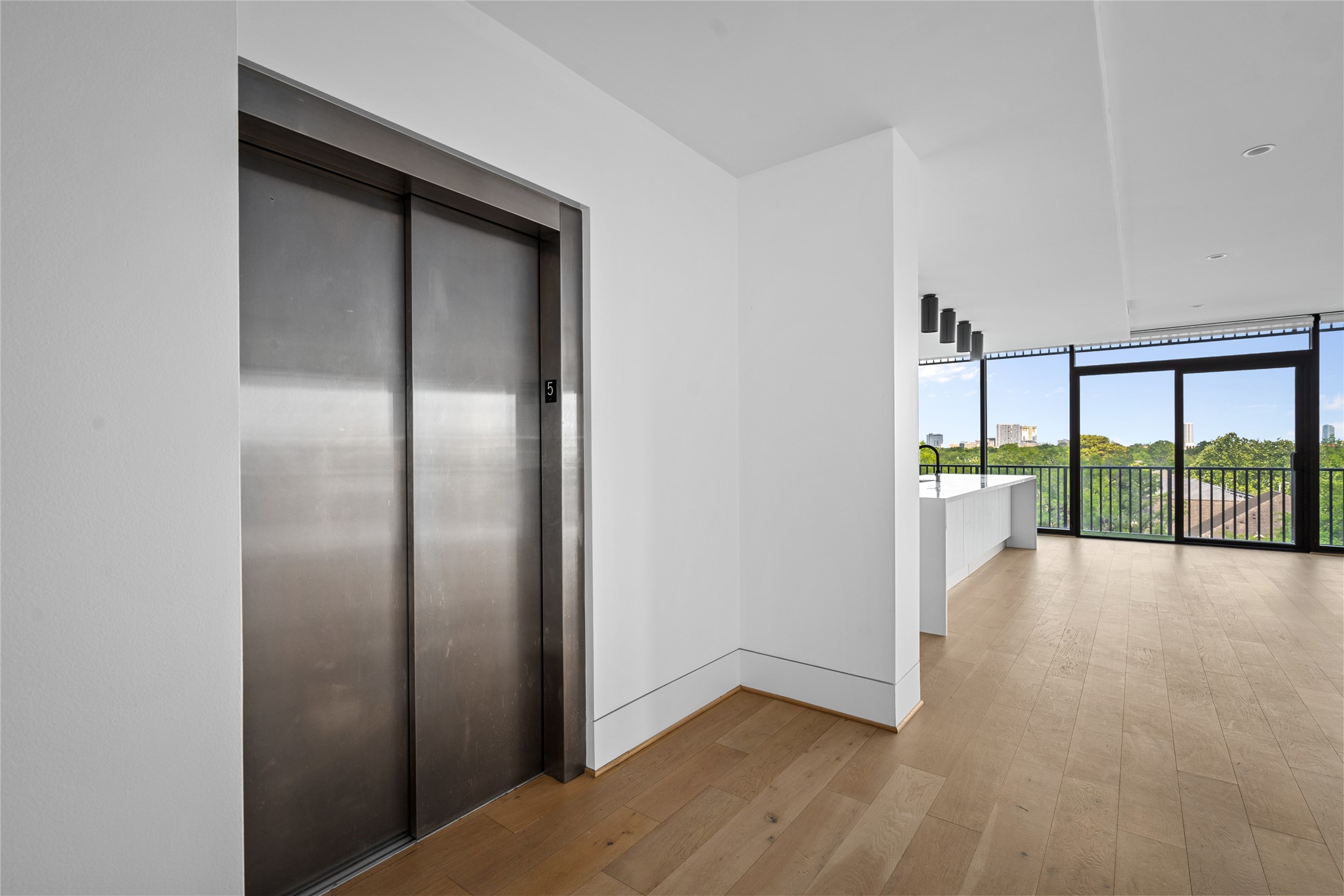 2406 Tangley Street, Unit 200 Houston, TX 77005 - Photo 2 of 20 an empty room with sliding door and mountain view
