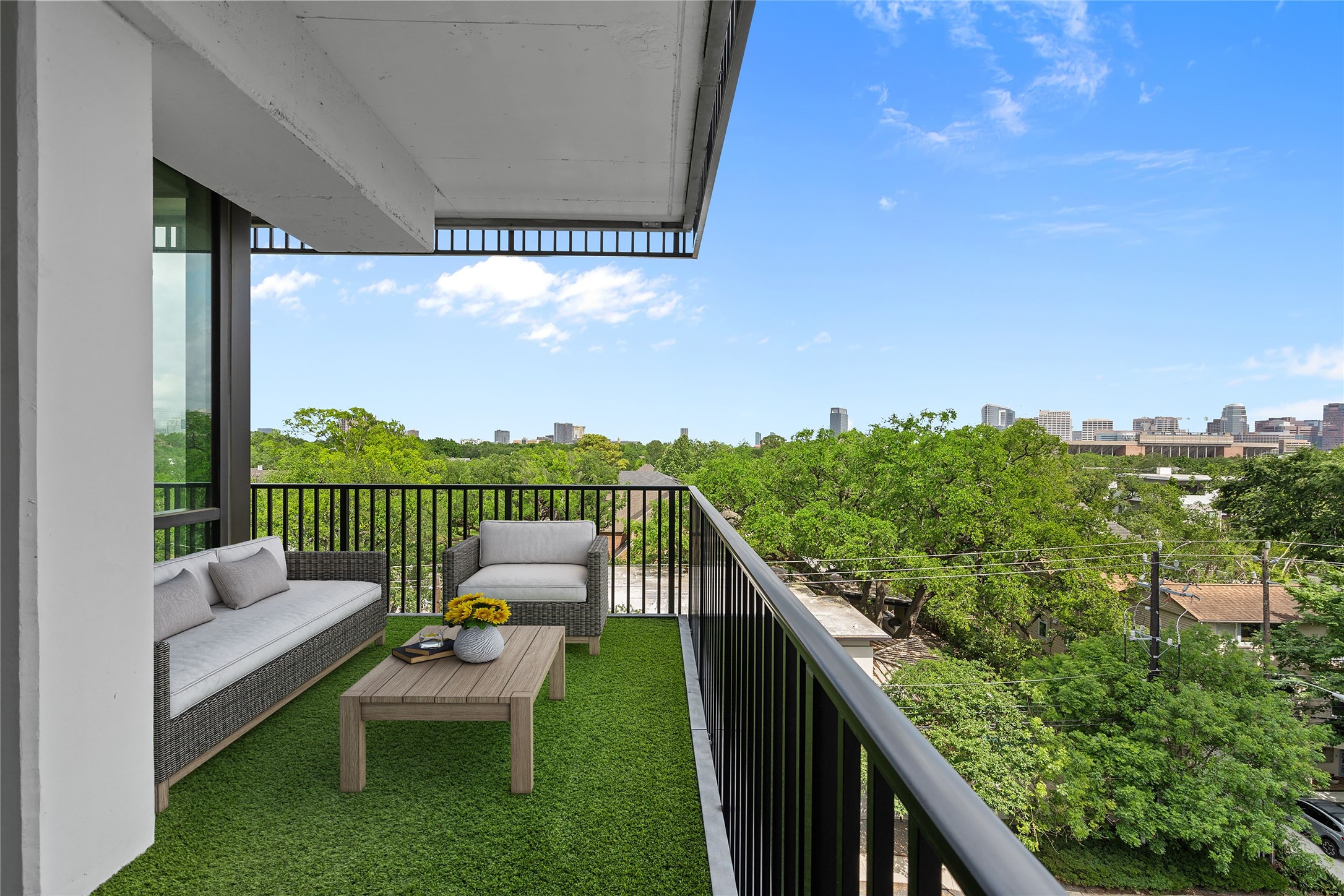 2406 Tangley Street, Unit 200 Houston, TX 77005 - Photo 9 of 20 a balcony with furniture and a garden