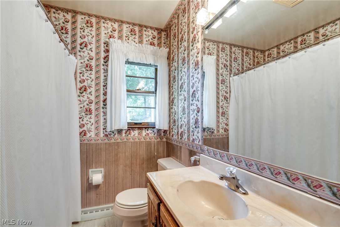 3799 Boydell Road Kent, OH 44240 - Photo 17 of 21 Bathroom with baseboard heating, toilet, and vanity