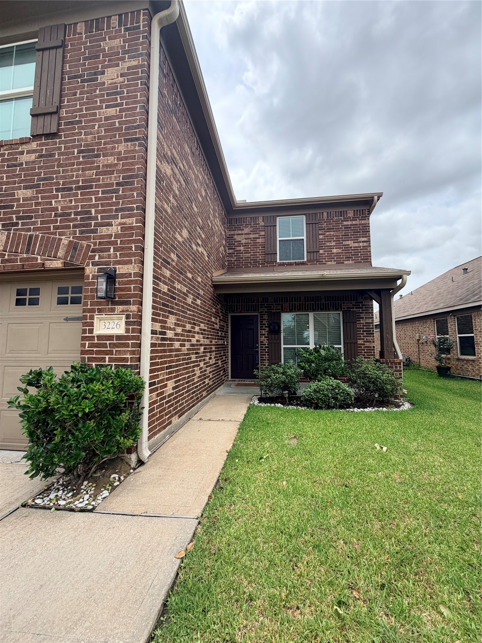 3226 Dappled Vale Trail Spring, TX 77373 - Photo 5 of 26 This is a two-story brick home with a covered entryway, featuring well-maintained landscaping and walkway leading to the front door.