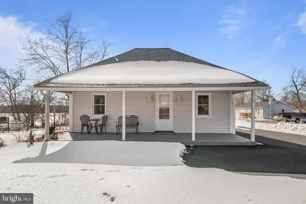 a front view of a house with yard
