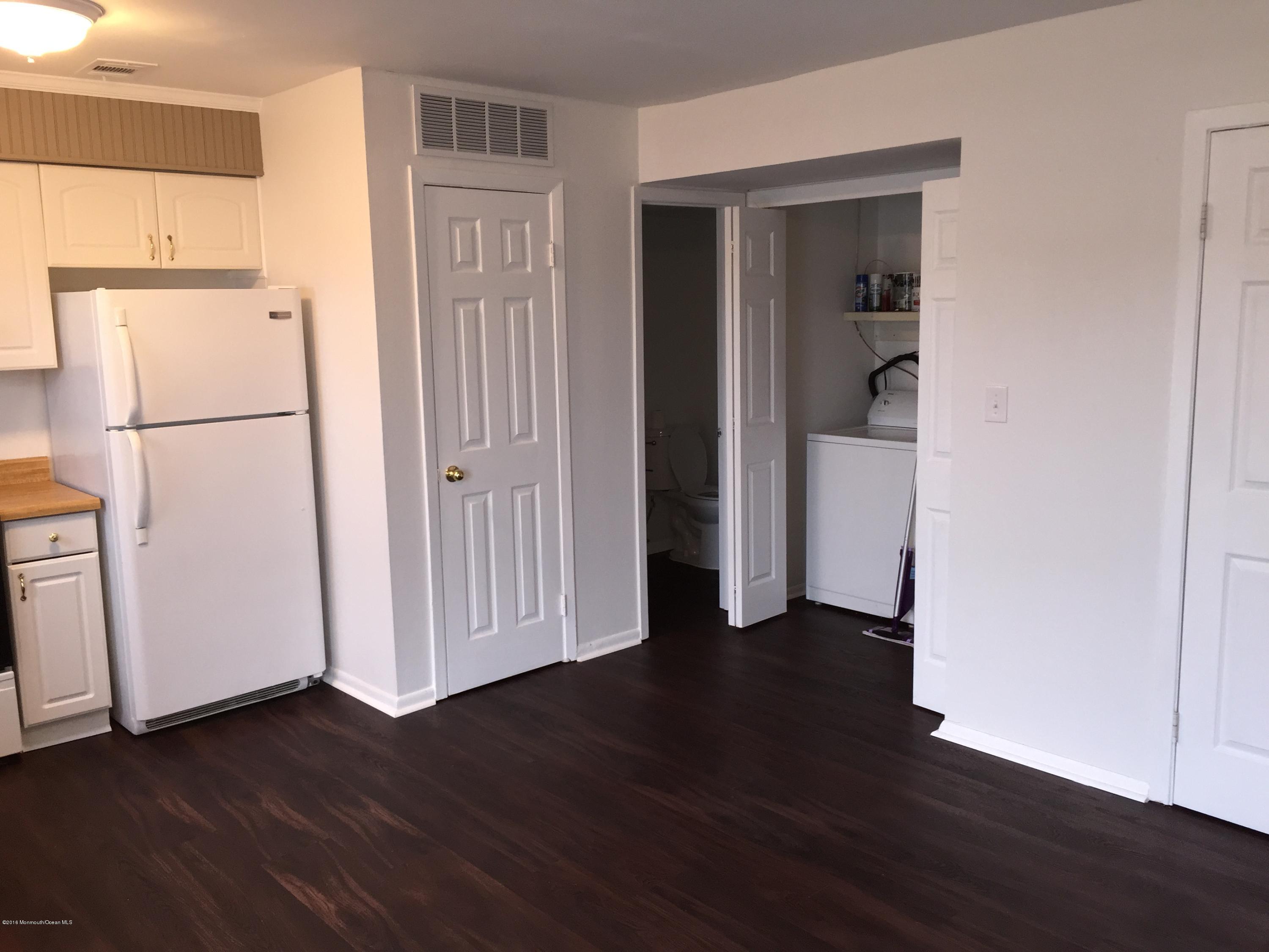 313 Sawmill Road, Unit 58 Brick, NJ 08724 - Photo 2 of 9 a view of a kitchen with wooden floor